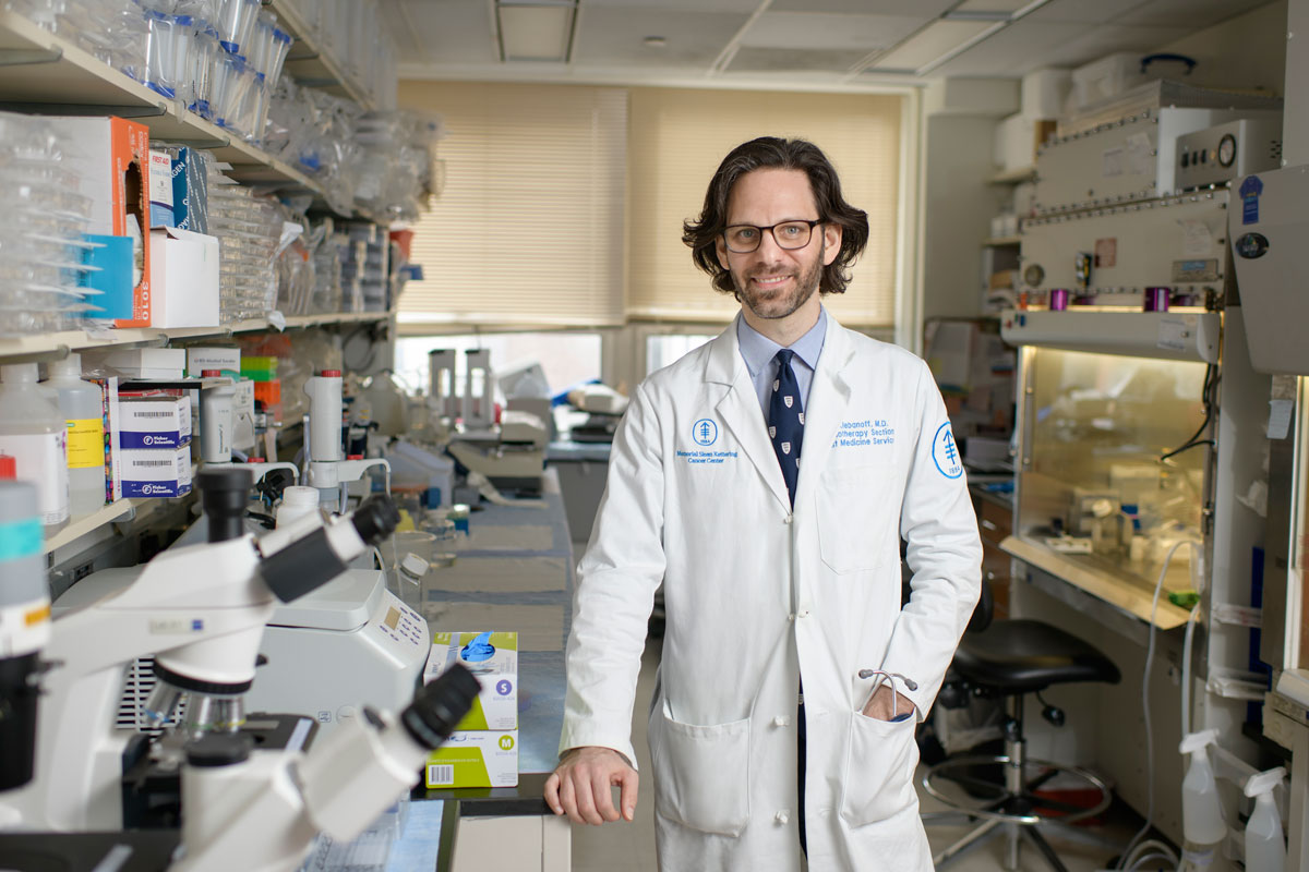 In his lab, physician-scientist Christopher Klebanoff is studying immunotherapies for people with breast cancer.