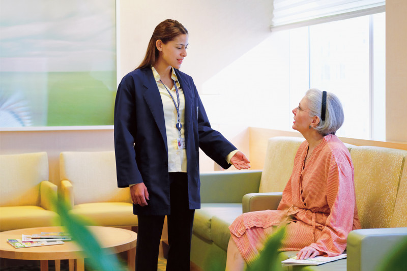 Patient waiting rooms are separated from public reception areas, affording patients an added degree of privacy. Session assistants (one is pictured above, in the blue jacket) escort patients to and from their appointments in the breast and imaging center.