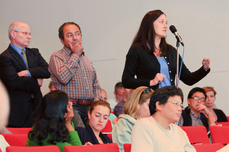 Memorial Sloan-Kettering investigators ask questions during the symposium