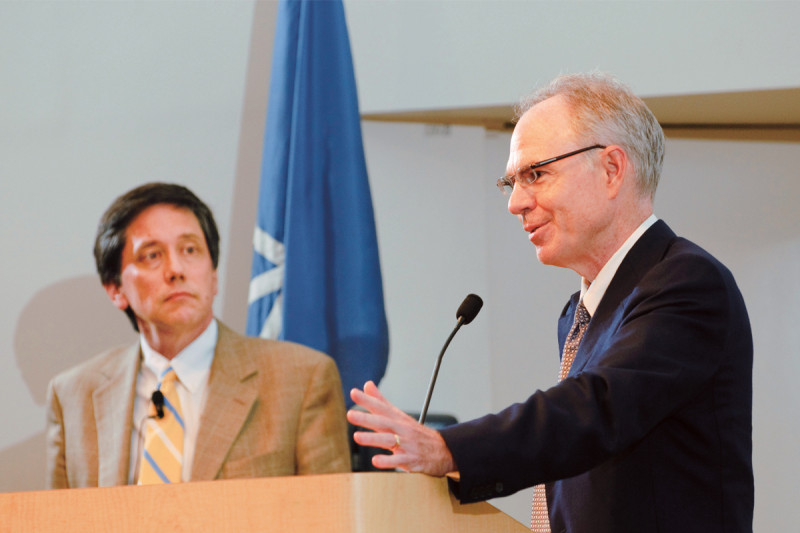 Symposium co-chair Charles Sawyers (right) in discussion with Timothy Wang