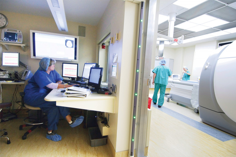 A single control room allows radiology technicians to monitor CIGI's two MRIs. One MRI has a wide bore, or opening, so that interventional radiologists can perform minimally invasive procedures while the device takes real-time images.