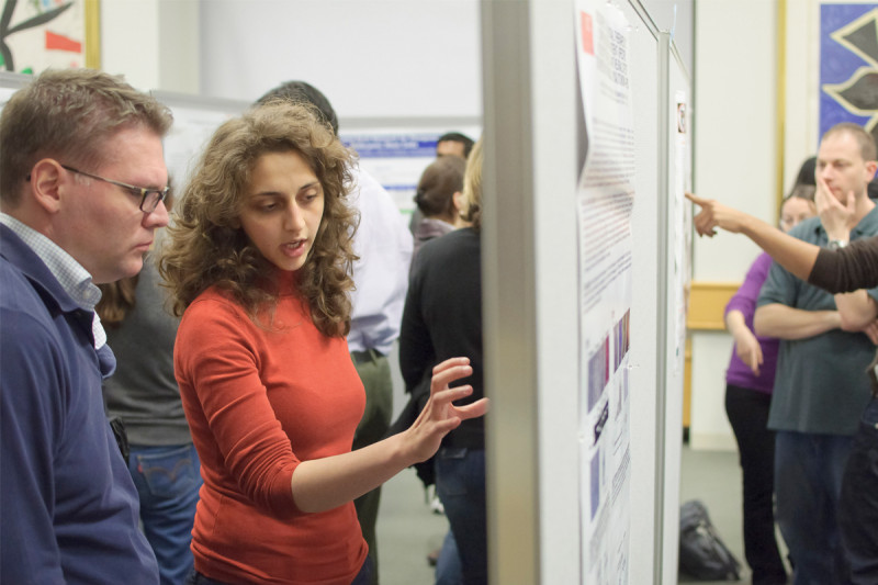 Memorial Sloan-Kettering researchers discussing their work at the poster session and reception