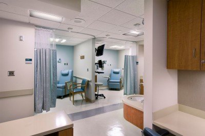 Private bays enhance comfort during intravenous procedures.