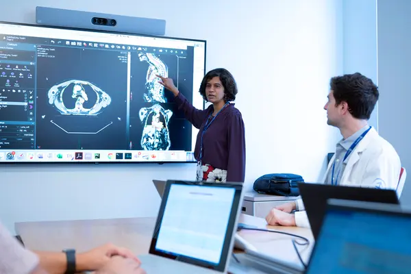 Dr. Harini Veeraraghavan, an MSK computer scientist, points to imaging scans analyzed by AI. 