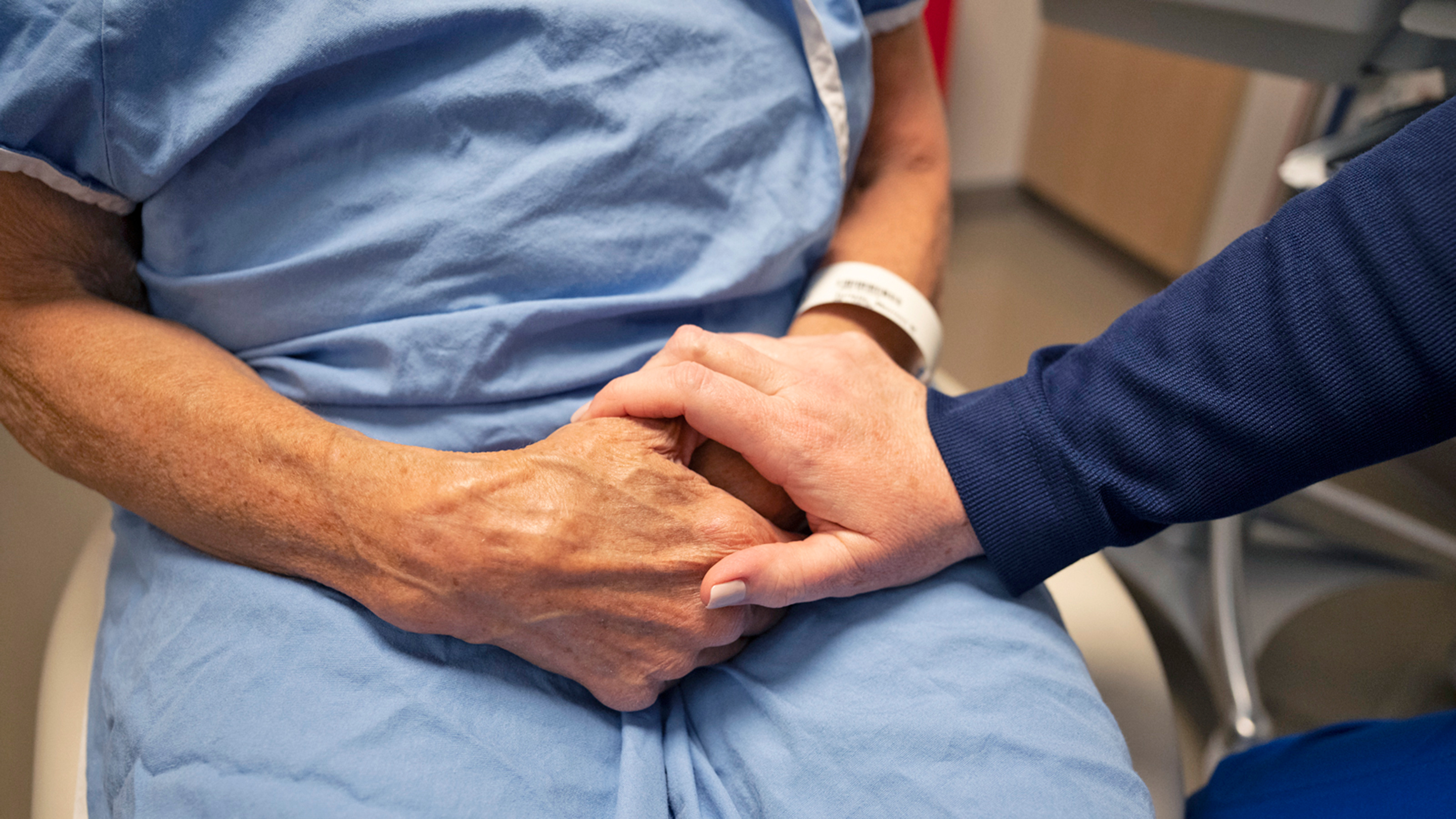 Patient holding hands with their doctor   