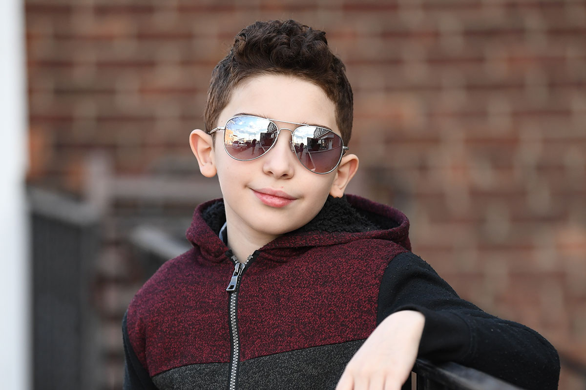 Young boy wearing sunglasses