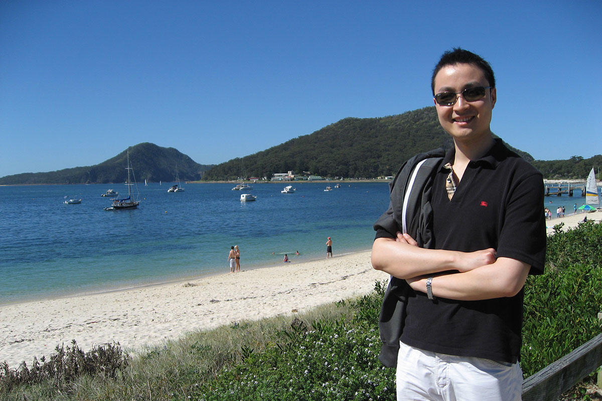 Bob Li with the beach in the background