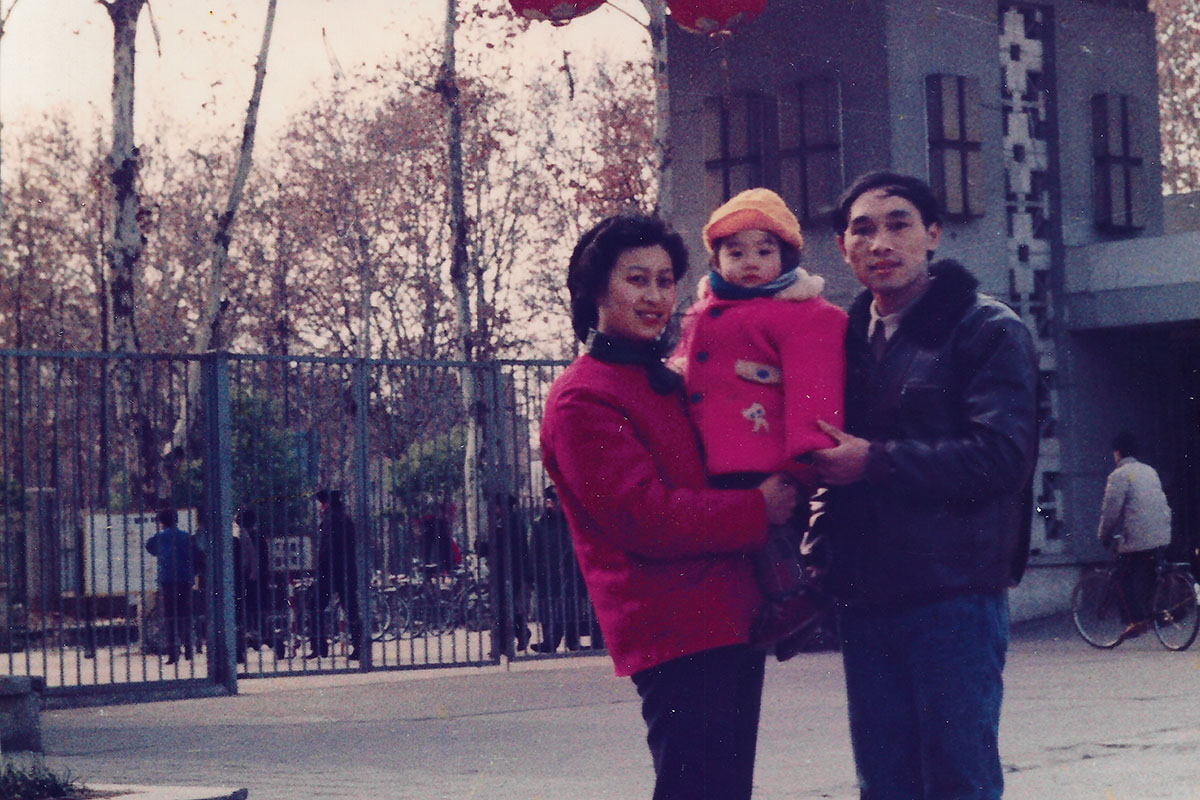 Dr. Liu with her parents in front of The Tongji Medical School in Wuhan, China