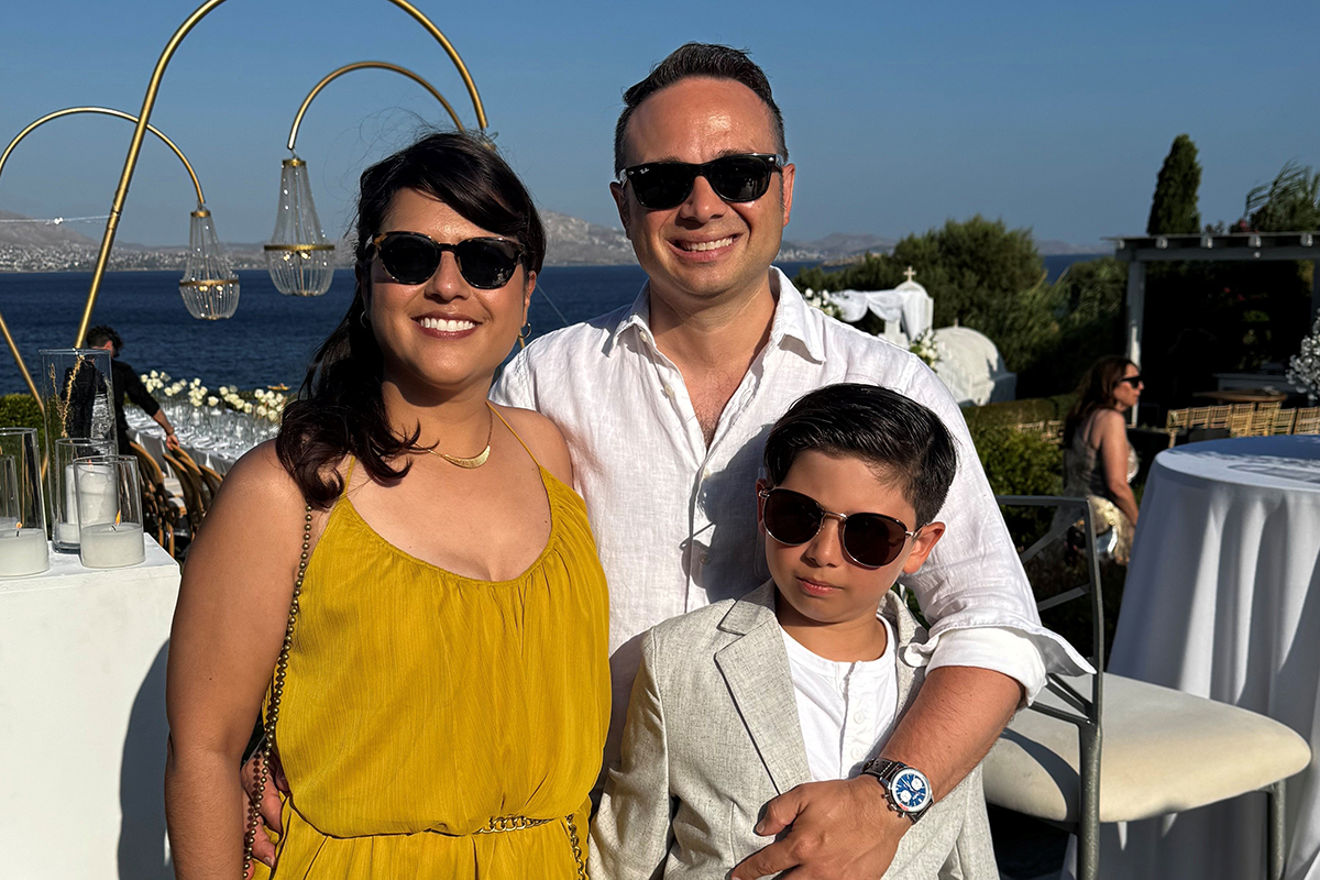 Breast cancer patient Michelle Villagomez with husband and son in Athens.