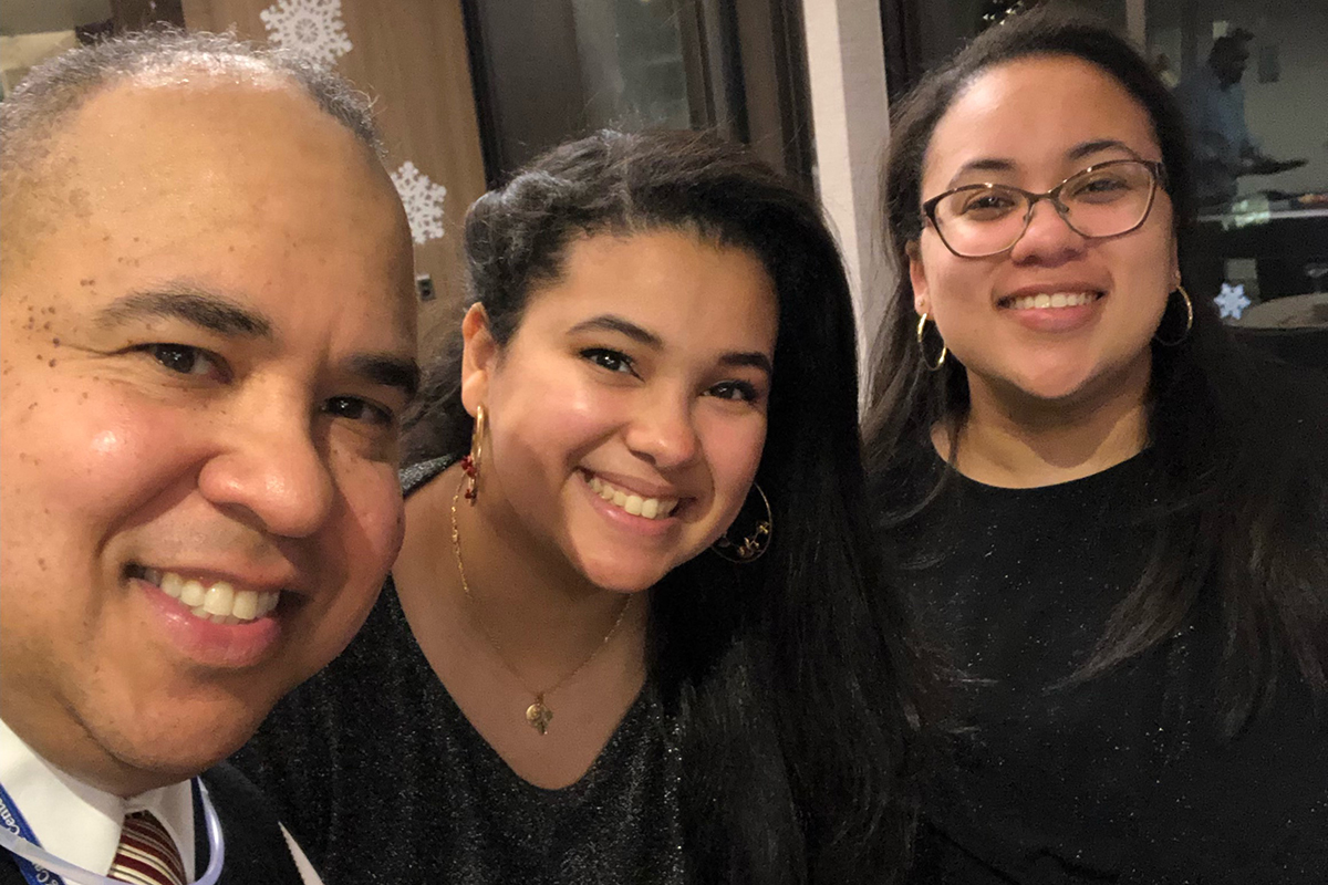 Jose Casa, MSK's Associate Director of Environmental Services, and two daughters attend a New Year’s Eve celebration at MSK