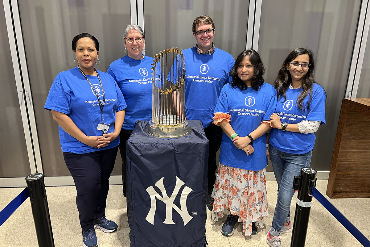 The MSK team poses with the 2009 World Series trophy, which was on display at the STEM Expo.