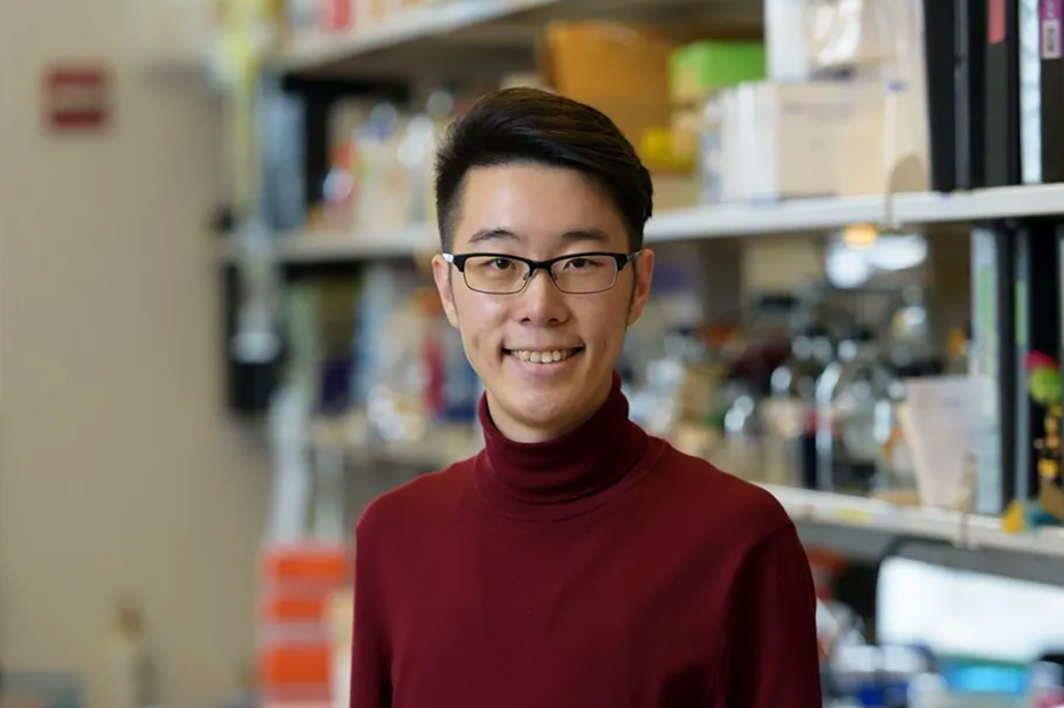 Zhong-Min Wang, PhD, poses smiling in the lab