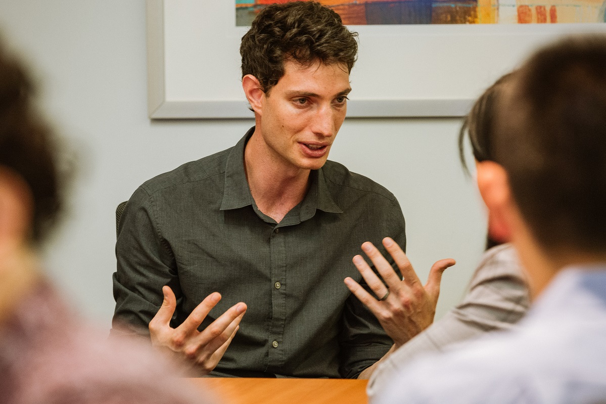 Faculty mentor Ed Reznik presents to QSURE interns