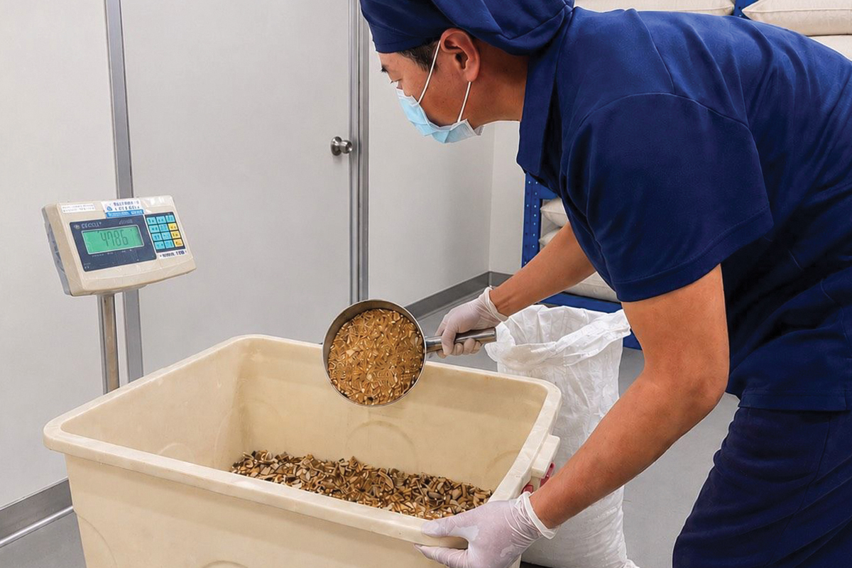 A technician weighs dried herbs
