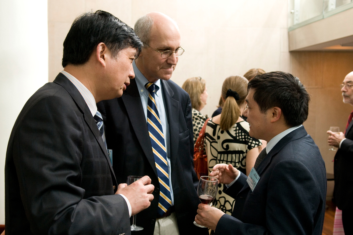 David Pfister speaks with members of the delegation at the reception.