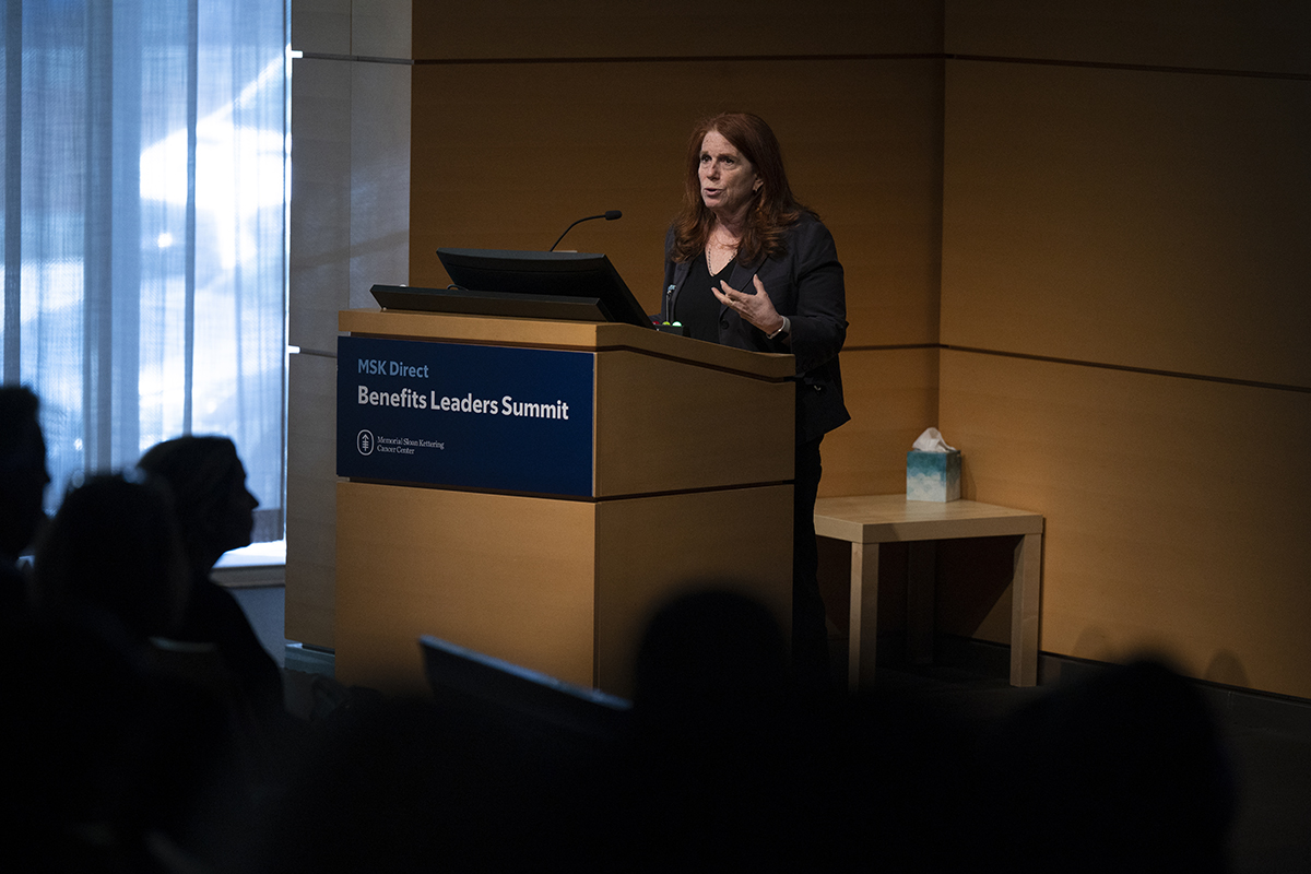 MSK female doctor giving presentation on cancer care