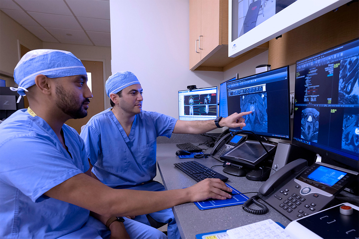 Daniel Gorovets, MD, Radiation Oncology Residency Program Director reviewing images with Nikhil Mankuzhy, MD, Radiation Oncology Resident.