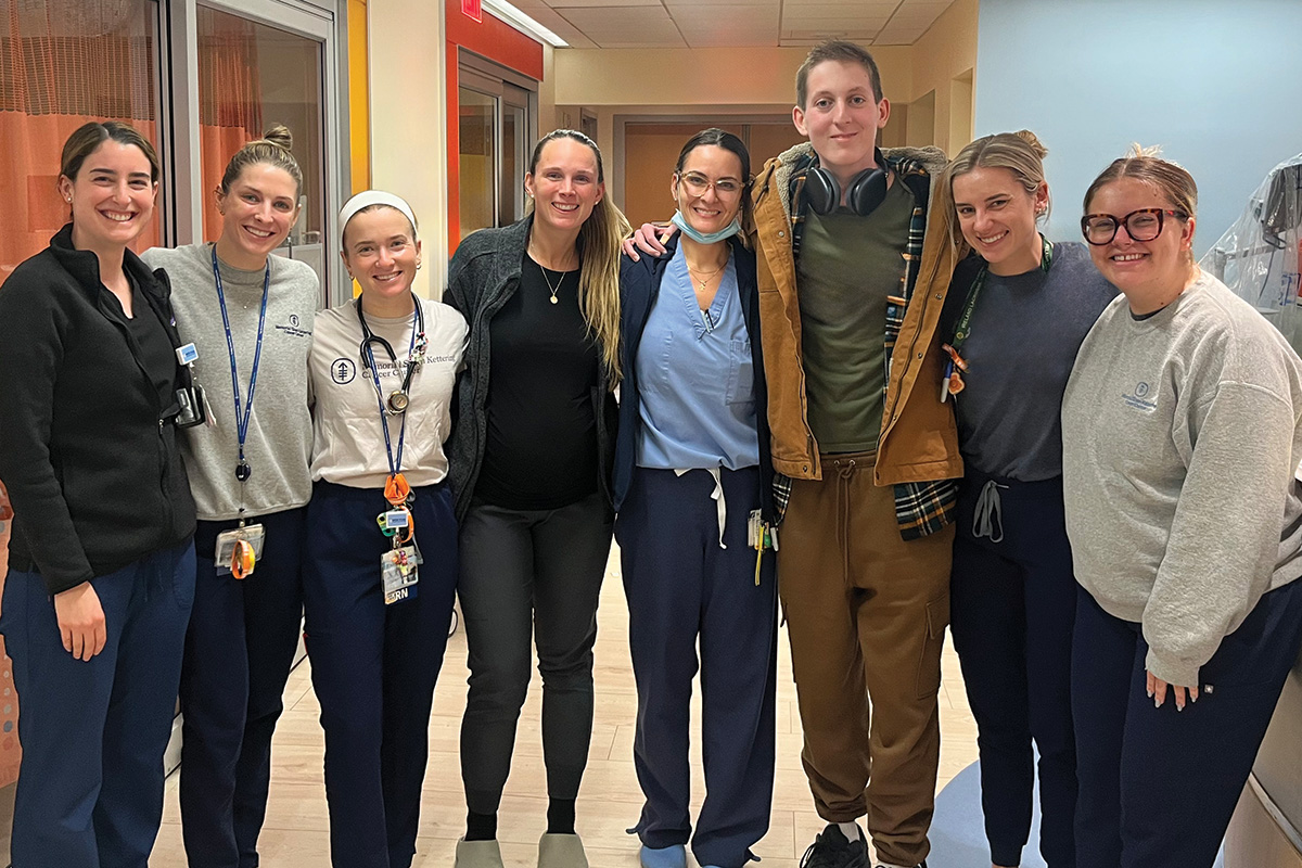 Tommy Ryan posing with seven of the MSK staffers who cared for himMSK 