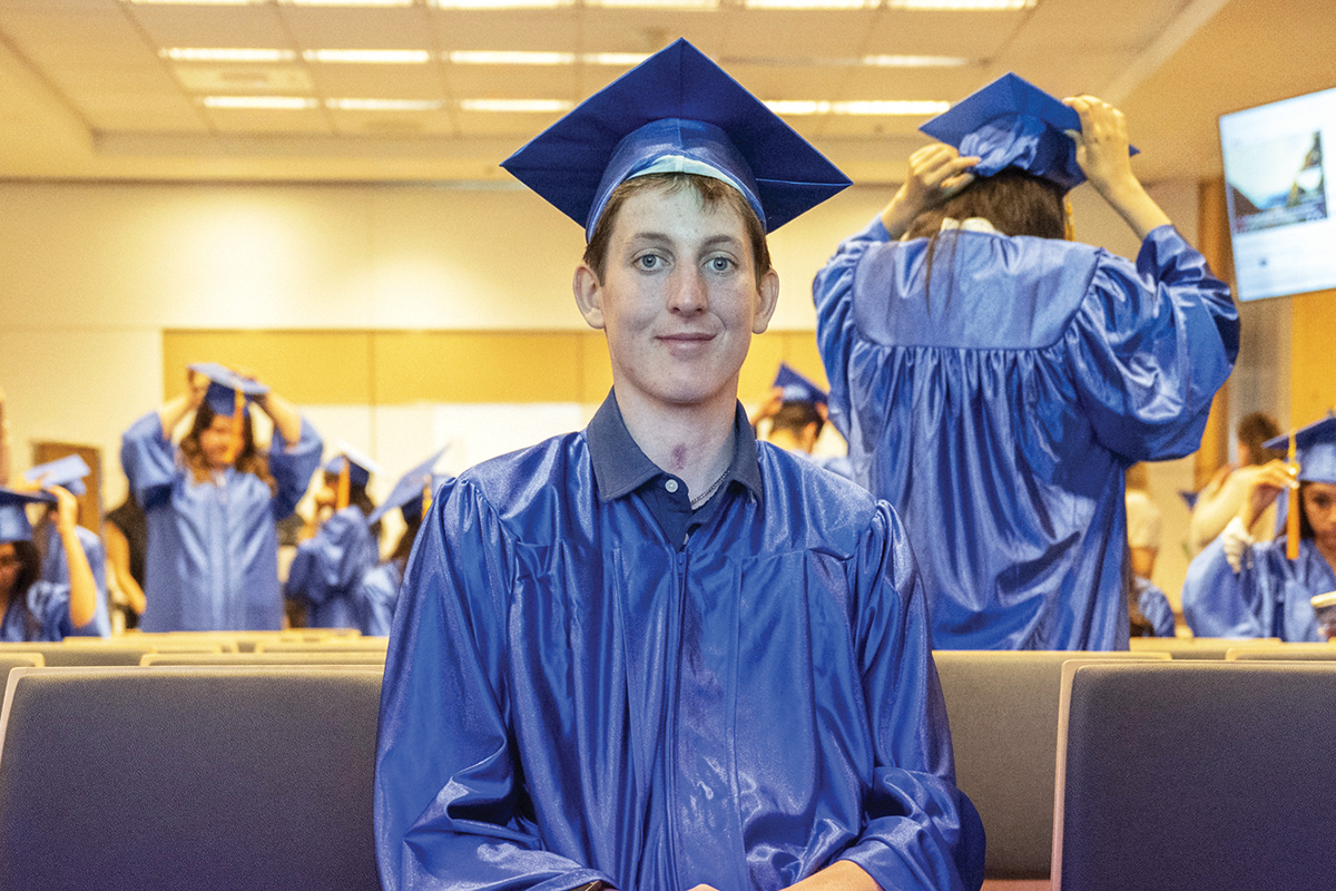 Tommy in blue cap and gown at the MSK Kids annual convocation