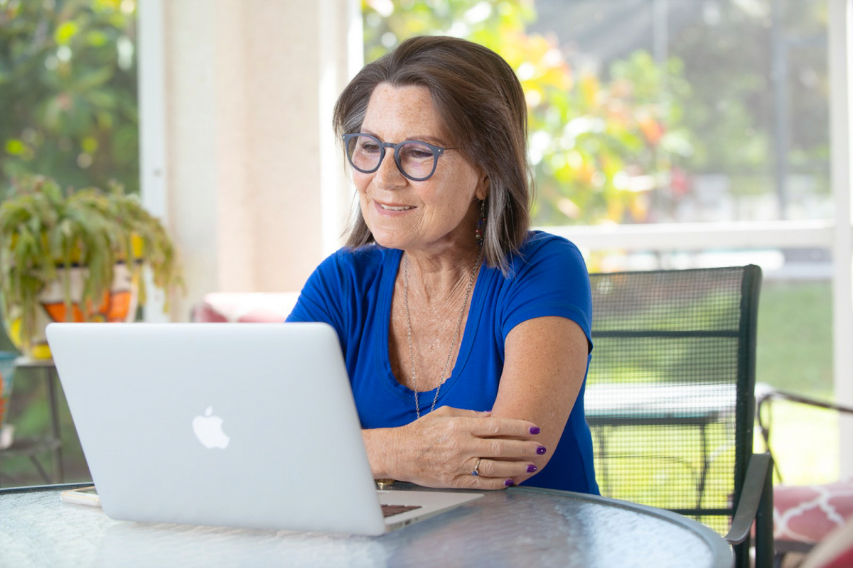 A woman looking at a computer