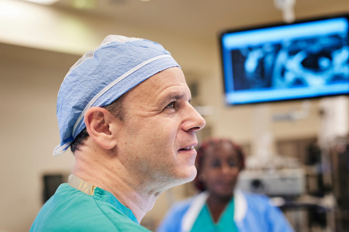 Dr. Mark Bilsky, Spine Neurosurgeon, in surgical attire in an operating room.