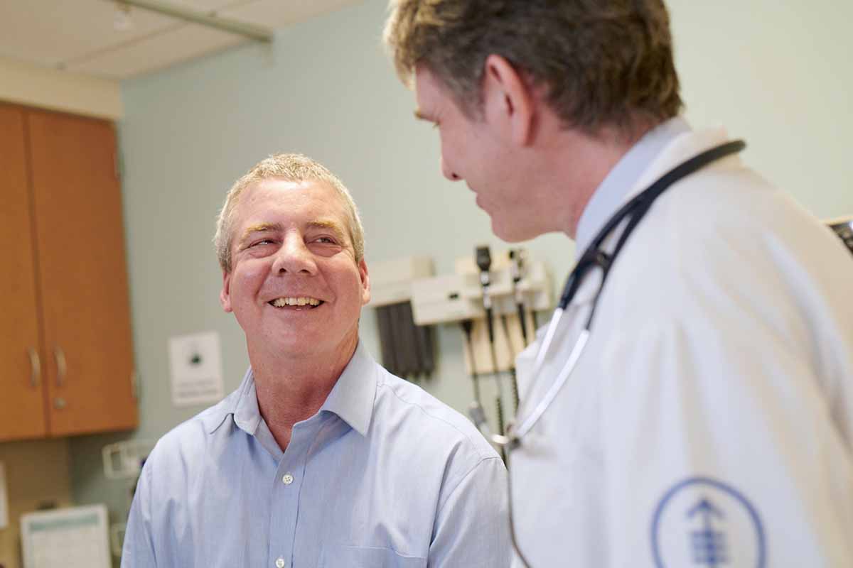 A leukemia patient meets with their doctor