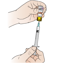 Figure 5. Drawing the Solu-Cortef into the syringe