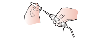 Figure 13. Removing protective covering from spike tip of the administration set