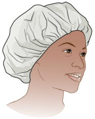 Person wearing a disposable hair bonnet