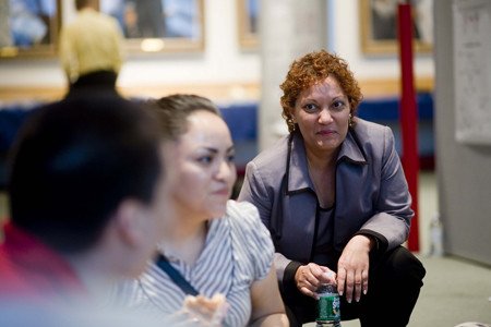 Associate Dean Gita Bosch (right) listens in on students' comments about the day.