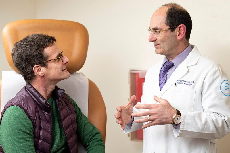MSK urologic surgeon, Bernard Bochner, speaks with a male patient.