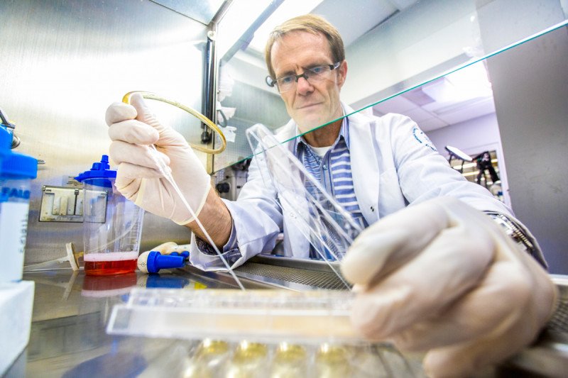 A scientist pictured in his lab