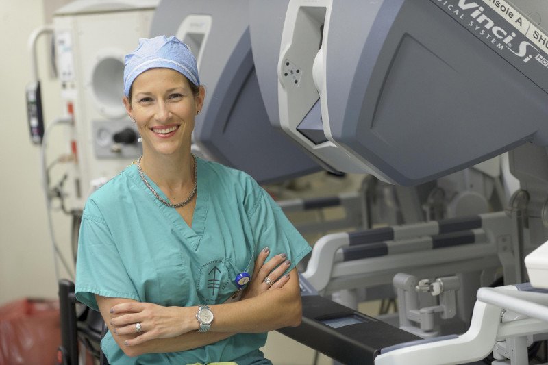 MSK surgeon Elizabeth Jewell stands near a surgical machine used for cervical cancer treatment