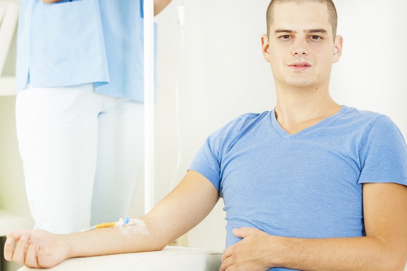 Young man receiving chemotherapy.