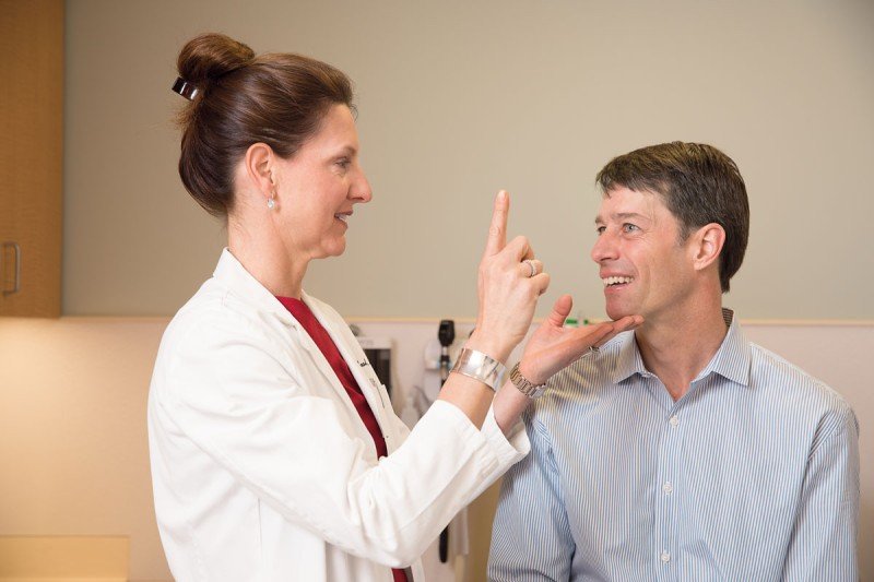 Radiation oncologist Kathryn Beal with a patient.