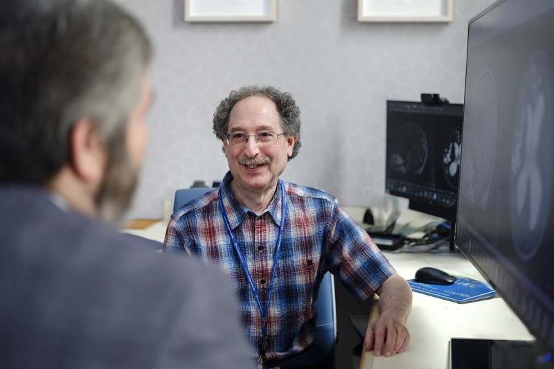 Pediatric hematologist-oncologist Ira J. Dunkel, MD, in the clinic with pediatric neurosurgeon Andrew Joshua Kobets, MD, MHS (at left).
