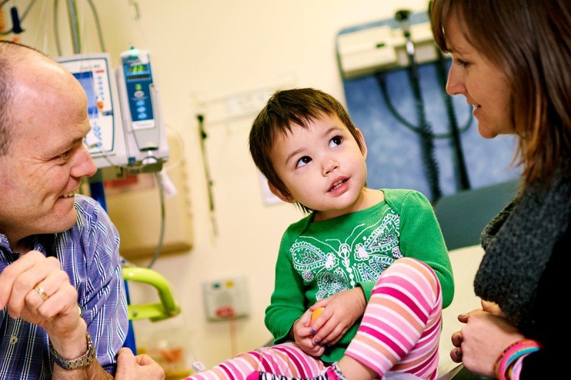 Pediatric neuroblastoma expert Stephen Roberts meets with a young patient