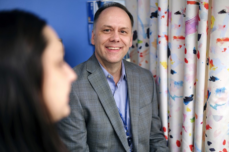 Pediatric hematologist-oncologist Damon Reed, MD, in an exam room with an MSK Kids patient. 