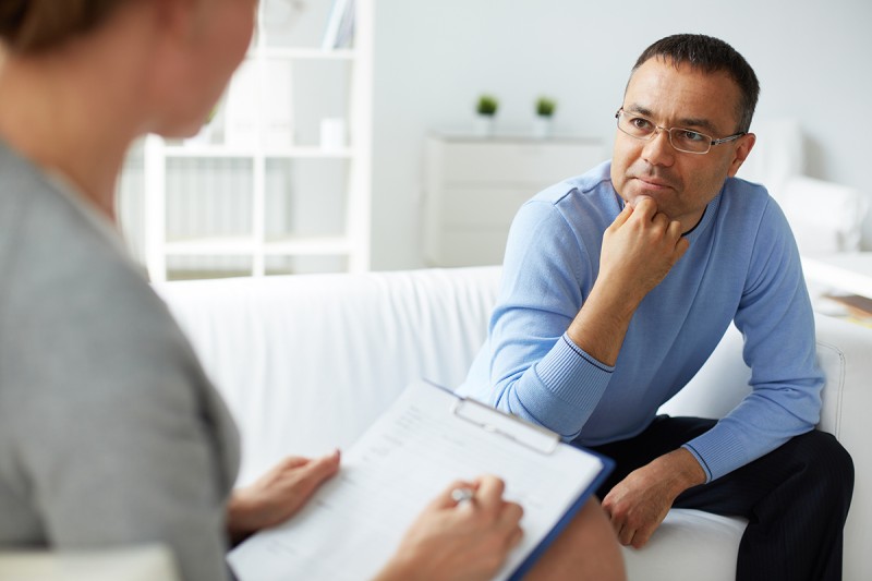 man talking with therapist