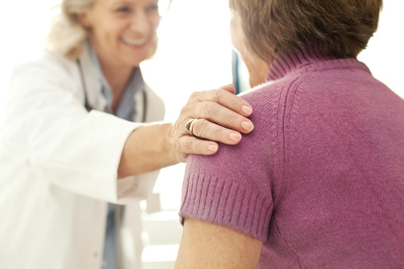 Doctor comforting patient