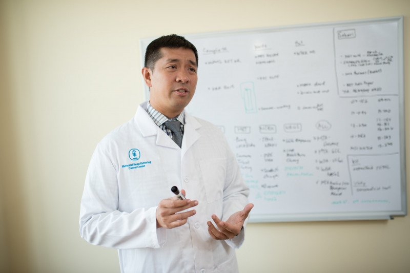 Physician standing in front of a whiteboard