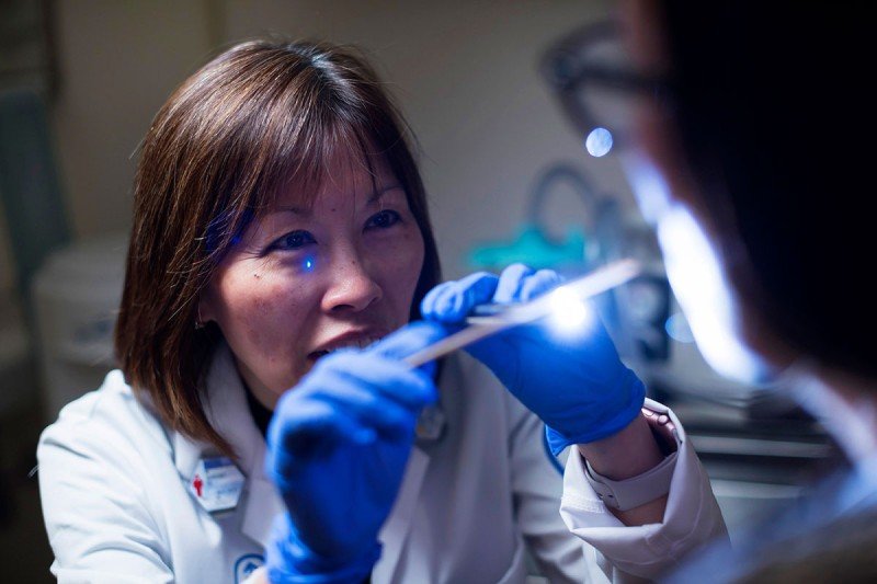 Memorial Sloan Kettering speech pathologist Margaret Ho helping treat a tongue cancer patient.