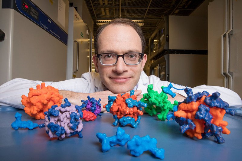 MSK chemist Daniel Heller with models of his nanoparticles