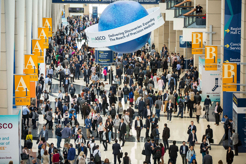 Crowded hall with ASCO signage