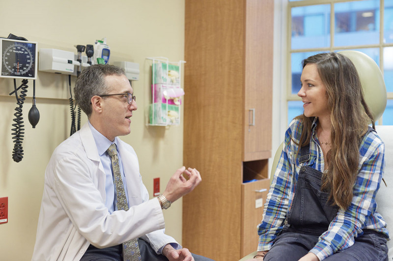 Melanoma expert Jedd Wolchok with a patient