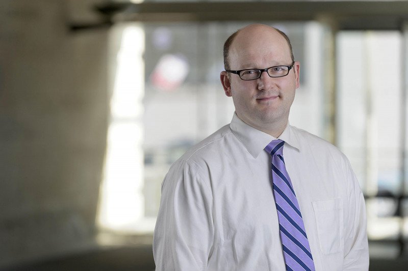 Neuro-oncologist Christian Grommes, who leads clinical research for CNS lymphoma at MSK, looks straight ahead.