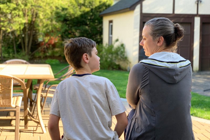 Mother and son speaking