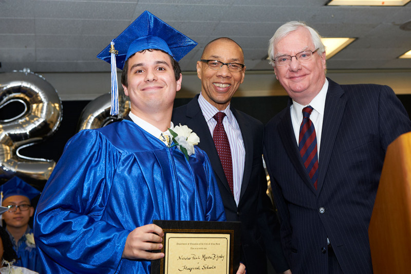 Nicholas receives the Chancellor’s Roll of Honor award from New York City Schools Chancellor Dennis Walcott (center) and Department of Pediatrics Chair Richard O’Reilly.