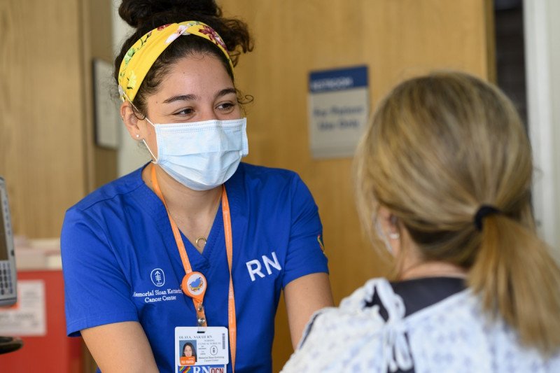 Clinical Nurse Sarah Olaya speaks with a patient.