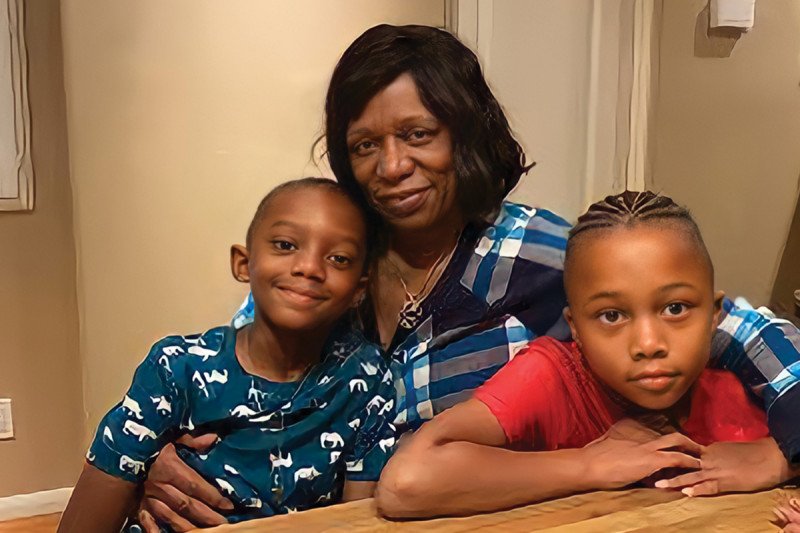 Ilene Thompson with her grandsons at the kitchen table